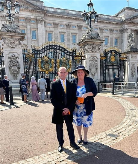 Mortuary supervisor Steve and his wife Diane outside Buckingham Palace
