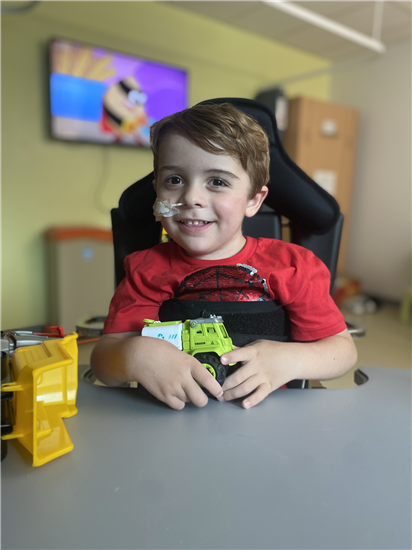 Freddie playing with toys as he recovers in Cardiff