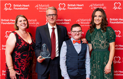 Professor Caputo is holding his award and standing with patient Calum Morris and BHF Ambassador Pippa Middleton.