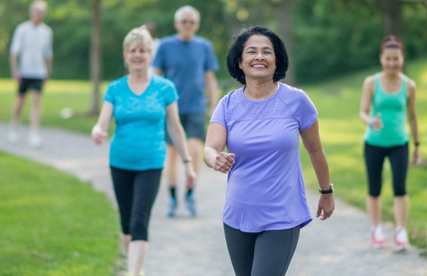 Preparing for your procedure image of a group of woman exercising - walking outdoors