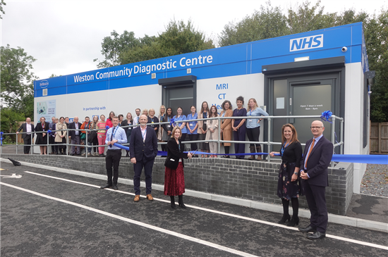 Maria Kane cutting the ribbon at the Weston CDC 