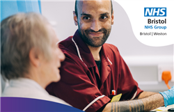 A member of staff smiling at a patient