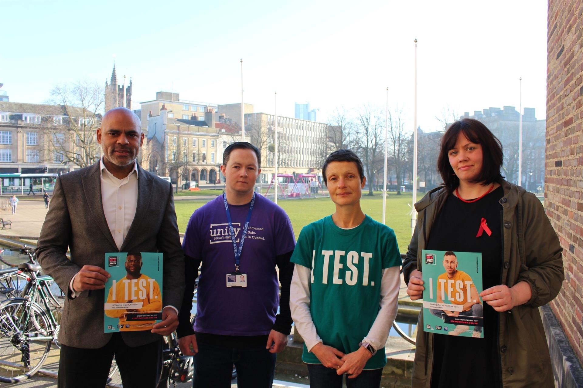 Mayor Marvin Rees and Councillor Ellie King and standing with the team from Unity Sexual Health