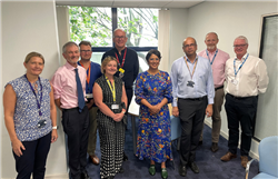 UHBW senior medical leadership team pose for a group photo with NHSE visitors